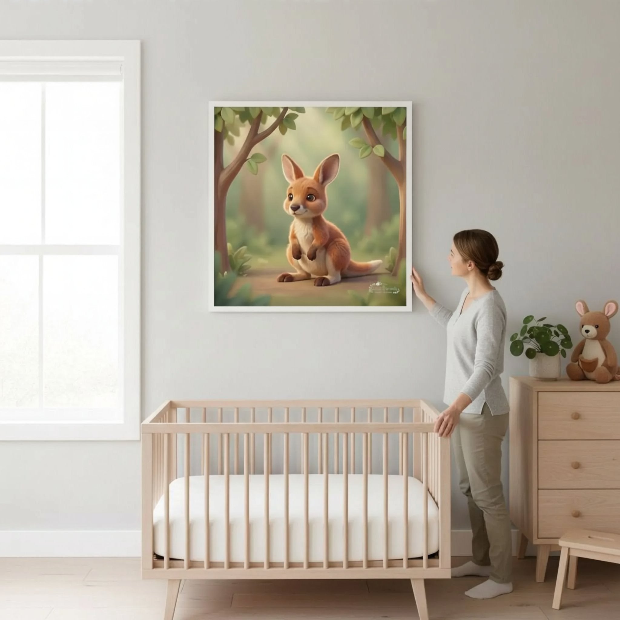 A woman stands in a nursery, looking at a framed painting of a kangaroo on the wall.